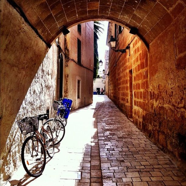 architecture, built structure, the way forward, arch, bicycle, building exterior, cobblestone, diminishing perspective, transportation, walkway, narrow, street, alley, footpath, vanishing point, wall - building feature, building, archway, paving stone, indoors