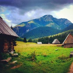 Scenic view of mountains against cloudy sky