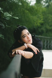 Portrait of young woman looking away