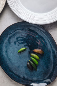 High angle view of fruits in plate on table