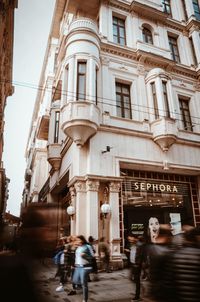 People walking on street in city