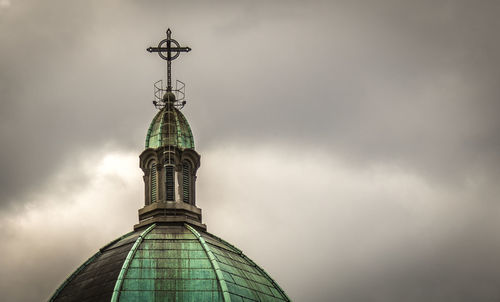 Low angle view of statue against cloudy sky