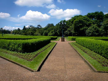 Scenic view of farm against sky