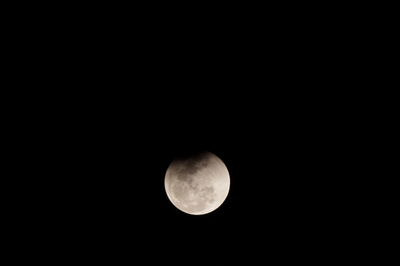 Low angle view of moon against clear sky at night