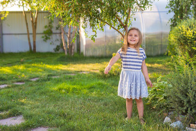 Portrait of smiling girl on field