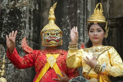 Close-up of buddha statue against temple