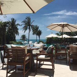 Chairs and tables at swimming pool