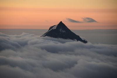 Scenic view of mountain against sky during sunset