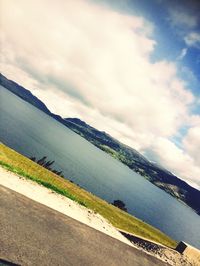 Scenic view of mountains against cloudy sky