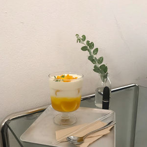 Tea cup on table against wall