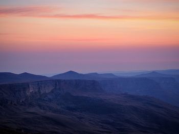 Scenic view of mountains against sky during sunset