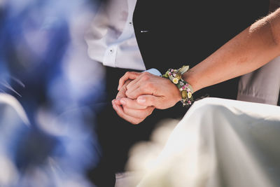 Close-up of couple holding hands