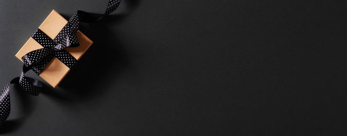 High angle view of paper on wall against black background