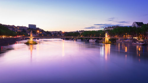 Scenic view of river with trees in background