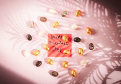 Chocolate candy eggs with a note world chocolate day.