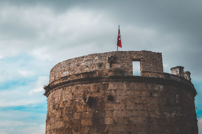 Low angle view of old ruins against sky