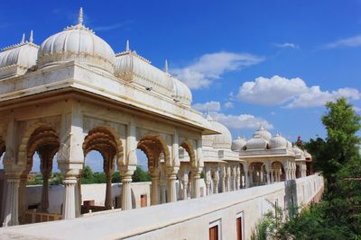 Historic buildings against sky during sunny day