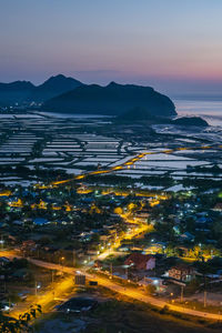 High angle view of city at sunset