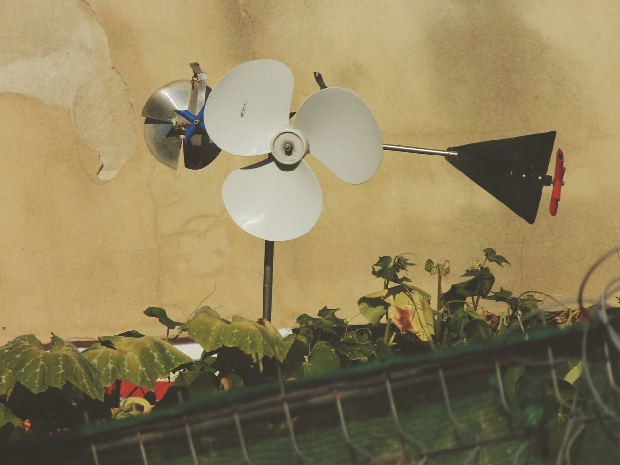 LOW ANGLE VIEW OF ELECTRIC FAN ON WALL