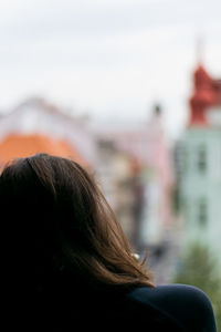 Rear view of woman against sky