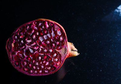 Close-up of strawberry against black background