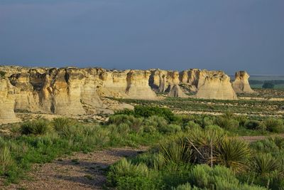 Scenic view of rock formations against sky