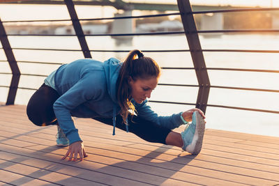 Confident woman exercising in city