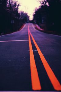 Close-up of zebra crossing on road