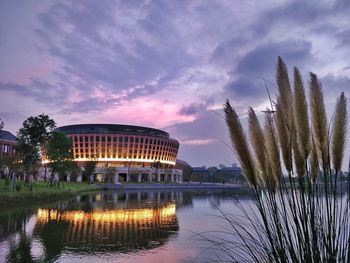 Reflection of building in lake at sunset