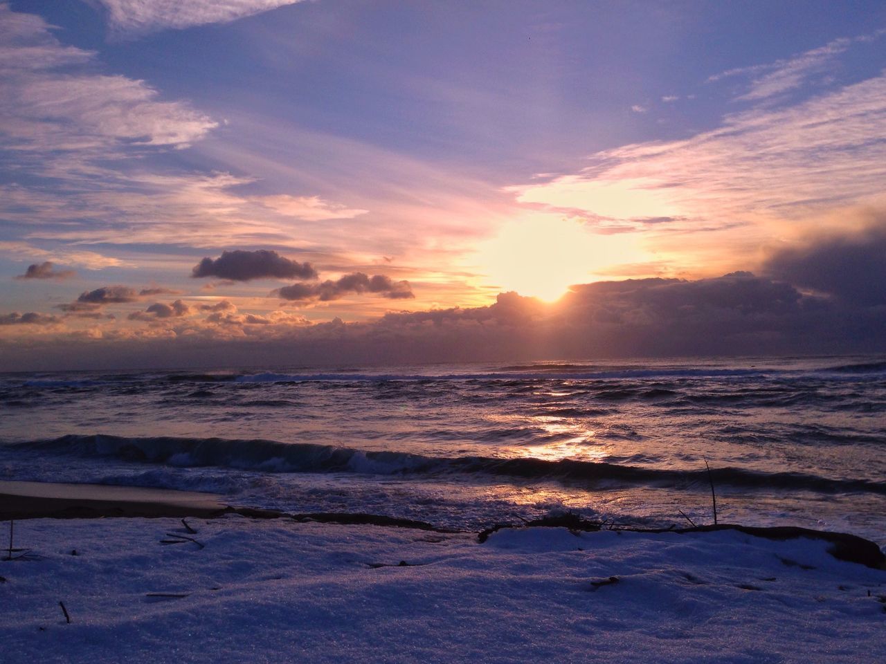 sunset, beach, sea, beauty in nature, sand, tranquility, nature, outdoors, wave, water, cloud - sky, sky, horizon over water, scenics, dramatic sky, no people, tranquil scene, vacations, sun, day