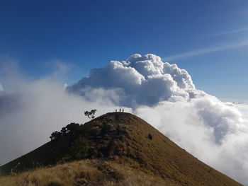 Low angle view of building on mountain against sky