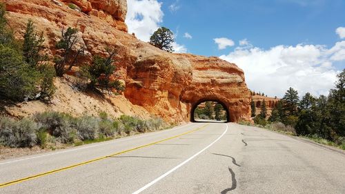 Scenic road through a stone arch in utah near bryce canyon