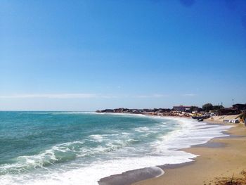 View of beach against blue sky