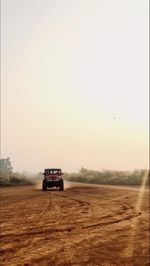 Road on field against sky