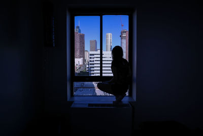 Man sitting in window