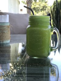 Close-up of glass of jar on table
