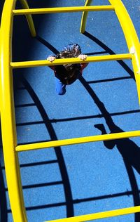 High angle view of yellow slide in playground