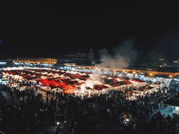 Crowd on illuminated city at night