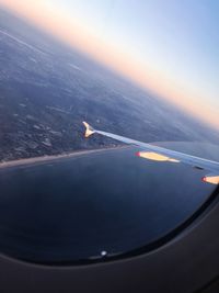 Aerial view of sea against sky during sunset