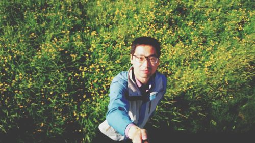 Portrait of young man standing outdoors