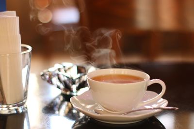 Close-up of coffee cup on table