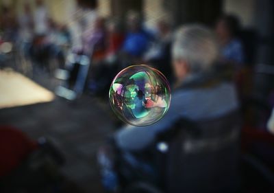 Close-up of bubble against blurred background
