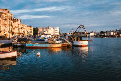 Oats moored in the port of taranto vecchia at dawn