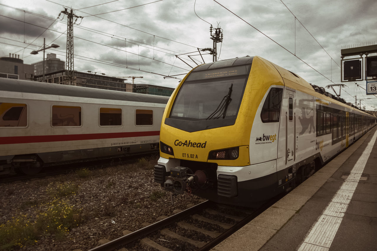 TRAIN AT RAILROAD STATION PLATFORM