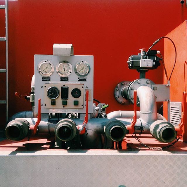 indoors, technology, old-fashioned, retro styled, still life, equipment, no people, machinery, close-up, communication, antique, metal, transportation, industry, number, red, connection, table, day, wall - building feature