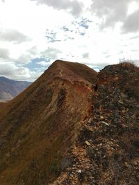 Scenic view of landscape against cloudy sky