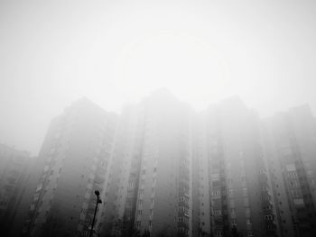 Panoramic view of city in foggy weather
