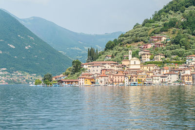 Landscape of the lakeside of peshiera maraglio in monte isola with beautiful colored houses 