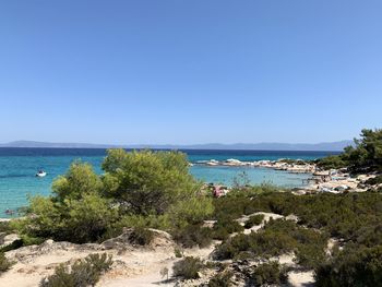 Scenic view of sea against clear blue sky