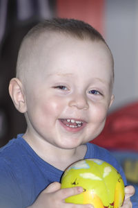 Portrait of happy boy with fruits